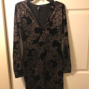 Black velvet with gold glitter accents.